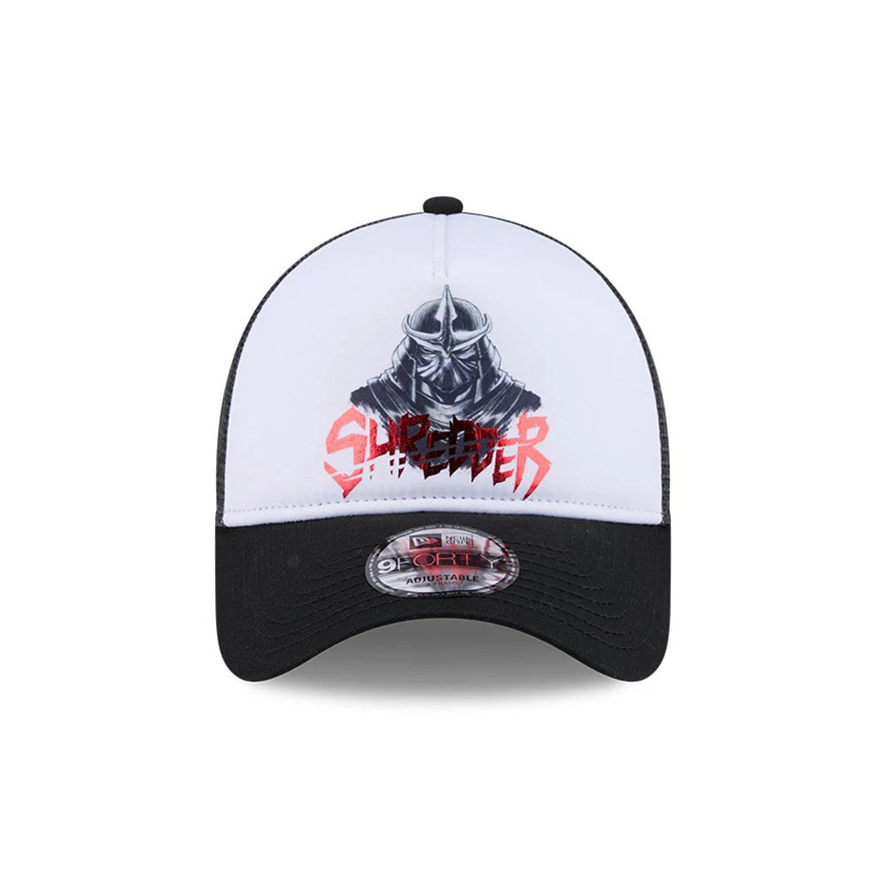 TMNT Splinter White & Black New Era 9FORTY A-Frame Trucker Adjustable Cap, front view showing a grey Shredder graphic with red lettering on the white front panel, contrasted by a black visor with a 9FORTY size sticker.