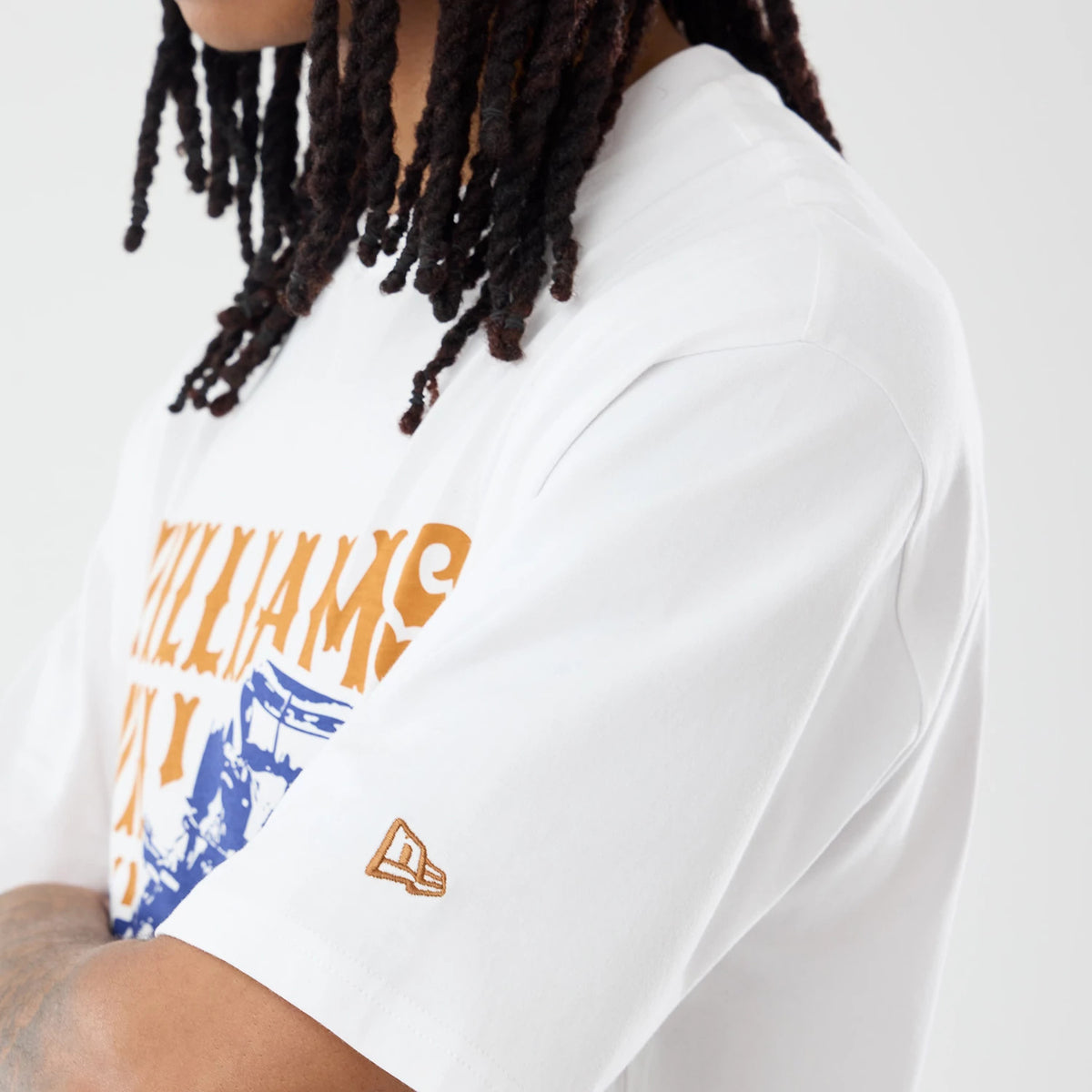 The model is wearing this Williams Austin Race Special Graphic Oversized T-Shirt in white. 3