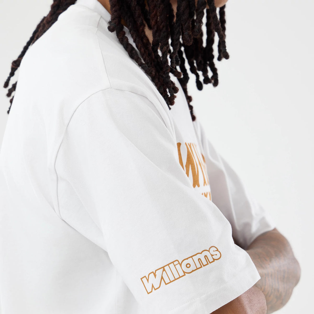 The model is wearing this Williams Austin Race Special Graphic Oversized T-Shirt in white. 4