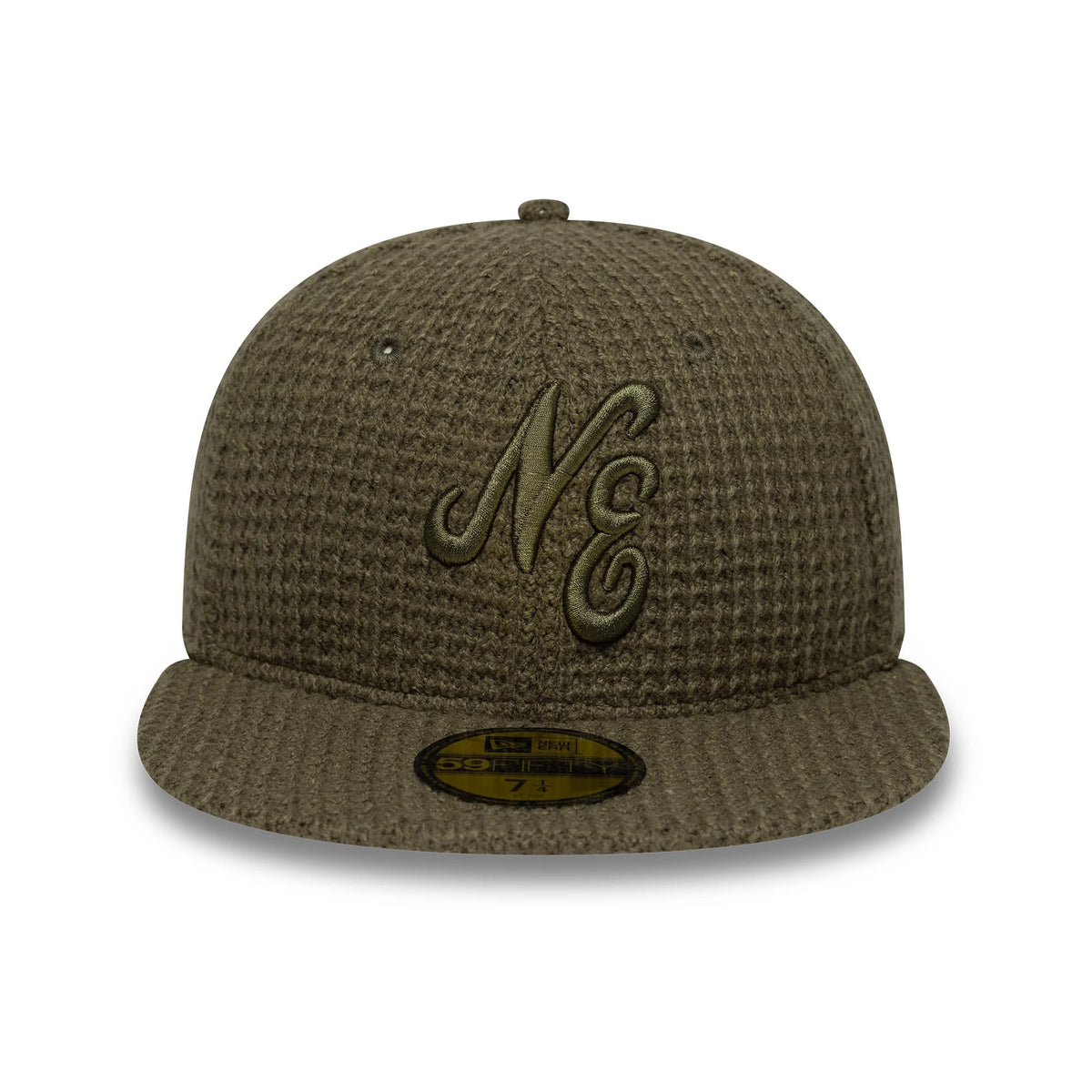 New Era Knitted Green 59FIFTY Fitted Cap, front view showing raised embroidery of the NE logo in matching green thread on the front panel, with a waffle knit pattern across the structured crown and a 59FIFTY size sticker on the flat visor.