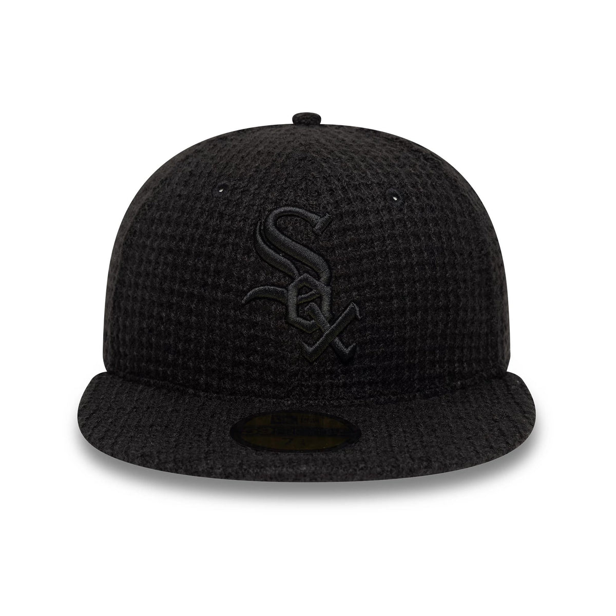 Chicago White Sox MLB Knitted Black New Era 59FIFTY Fitted Cap, front view showing the raised embroidered black White Sox logo on the textured black crown, with a black flat visor and gold 59FIFTY size sticker on the underside.