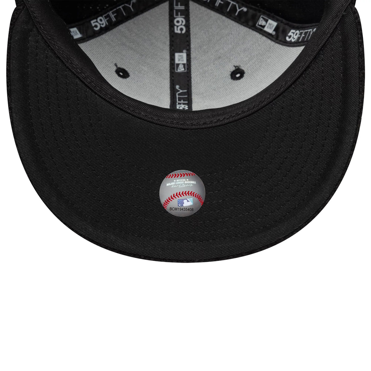 Chicago White Sox MLB Knitted Black New Era 59FIFTY Fitted Cap, inside view showing black 59FIFTY taping along the seams, a white sweatband and a grey undervisor with a baseball-themed sticker featuring red stitching and MLB graphics.