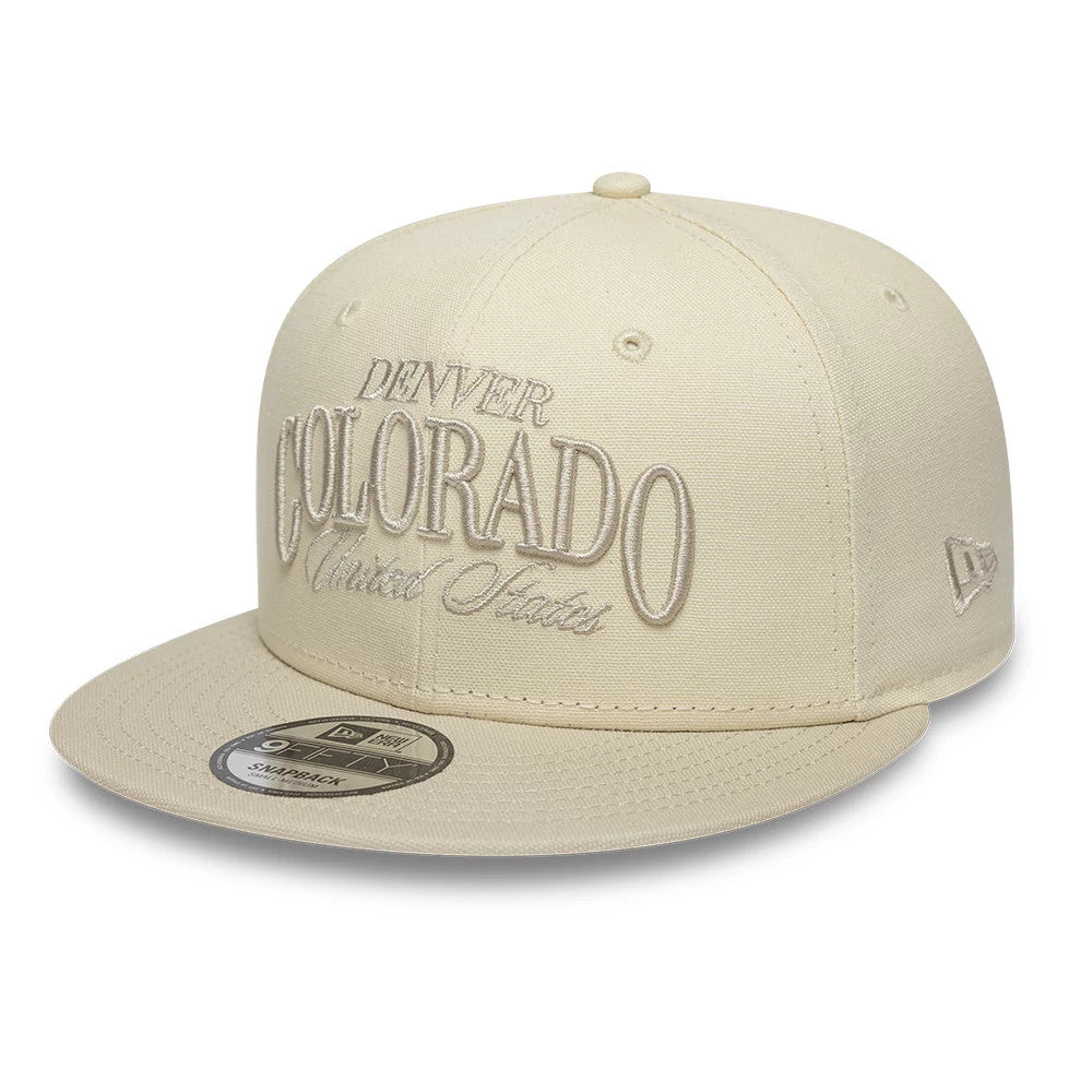 Pictured is this New Era Fabric Script 9FIFTY Snapback cap in cream. 1