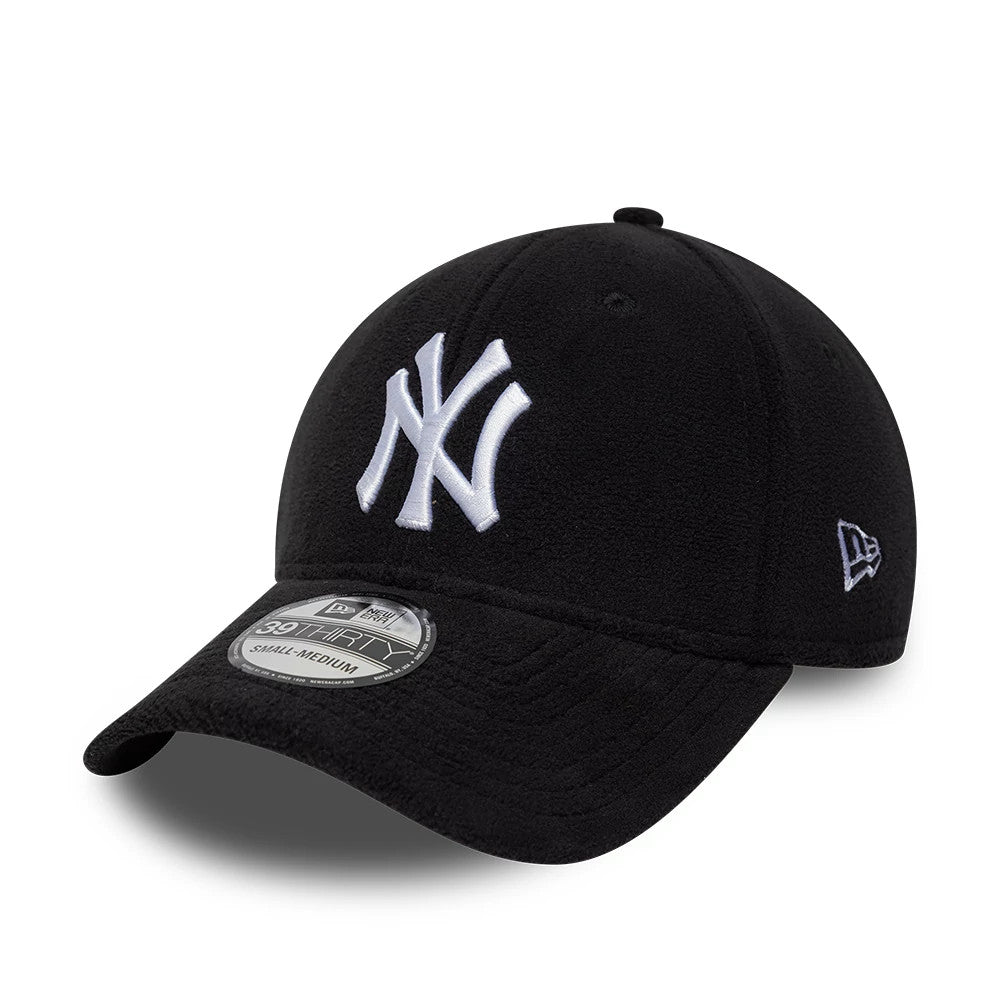 New York Yankees MLB Fleece Black New Era 39THIRTY Stretch Fit Cap, three-quarter view showing the large white embroidered NY logo on the front panel, a curved black visor with the 39THIRTY size sticker, and the New Era flag logo on the left side.