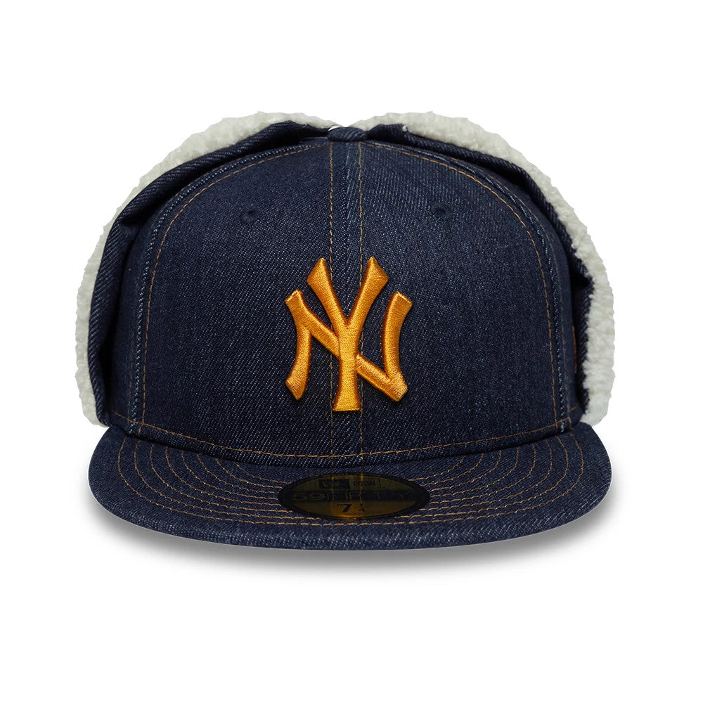 New York Yankees MLB Denim Navy Dogear New Era 59FIFTY Fitted Cap, front view showing the raised yellow NY logo embroidered on the denim front panel, with a flat denim visor featuring a gold 59FIFTY size sticker.