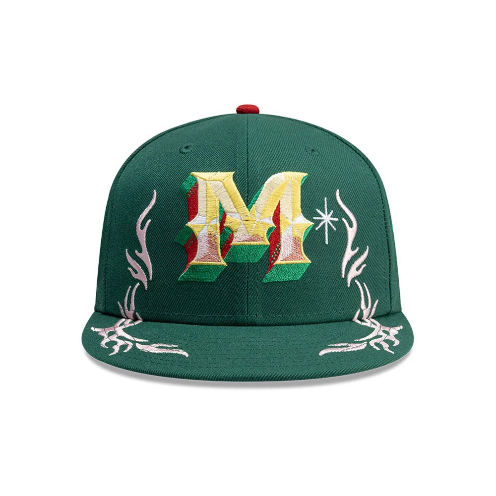 New Era Mexico Rotulos Green 59FIFTY Fitted Cap, front view showing an M logo in yellow, green, and red raised embroidery on the front panel, flanked by decorative white embroidery, with a matching flat green visor.