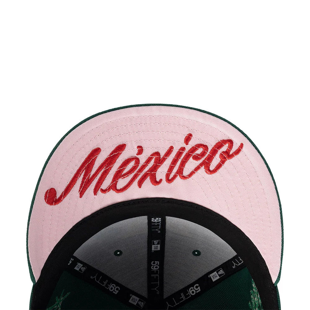 New Era Mexico Rotulos Green 59FIFTY Fitted Cap, inside view showing the pink undervisor with red embroidered México script, black sweatband, and New Era 59FIFTY branded taping across the inner crown.