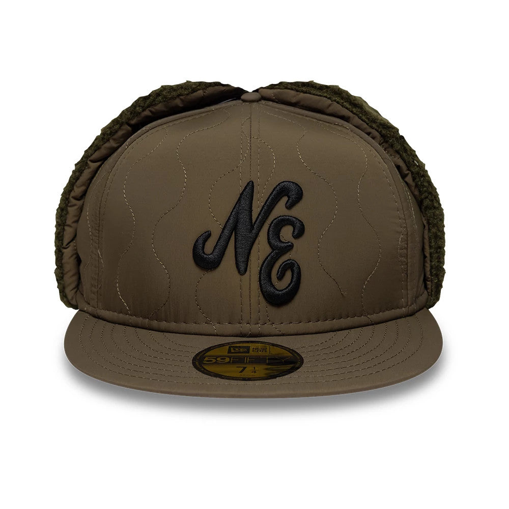 New Era Quilted Dark Green Dogear 59FIFTY Fitted Cap, front view showing the raised black NE embroidery on the quilted crown, with thick padded ear flaps folded up and a matching dark green visor featuring a gold 59FIFTY size sticker.