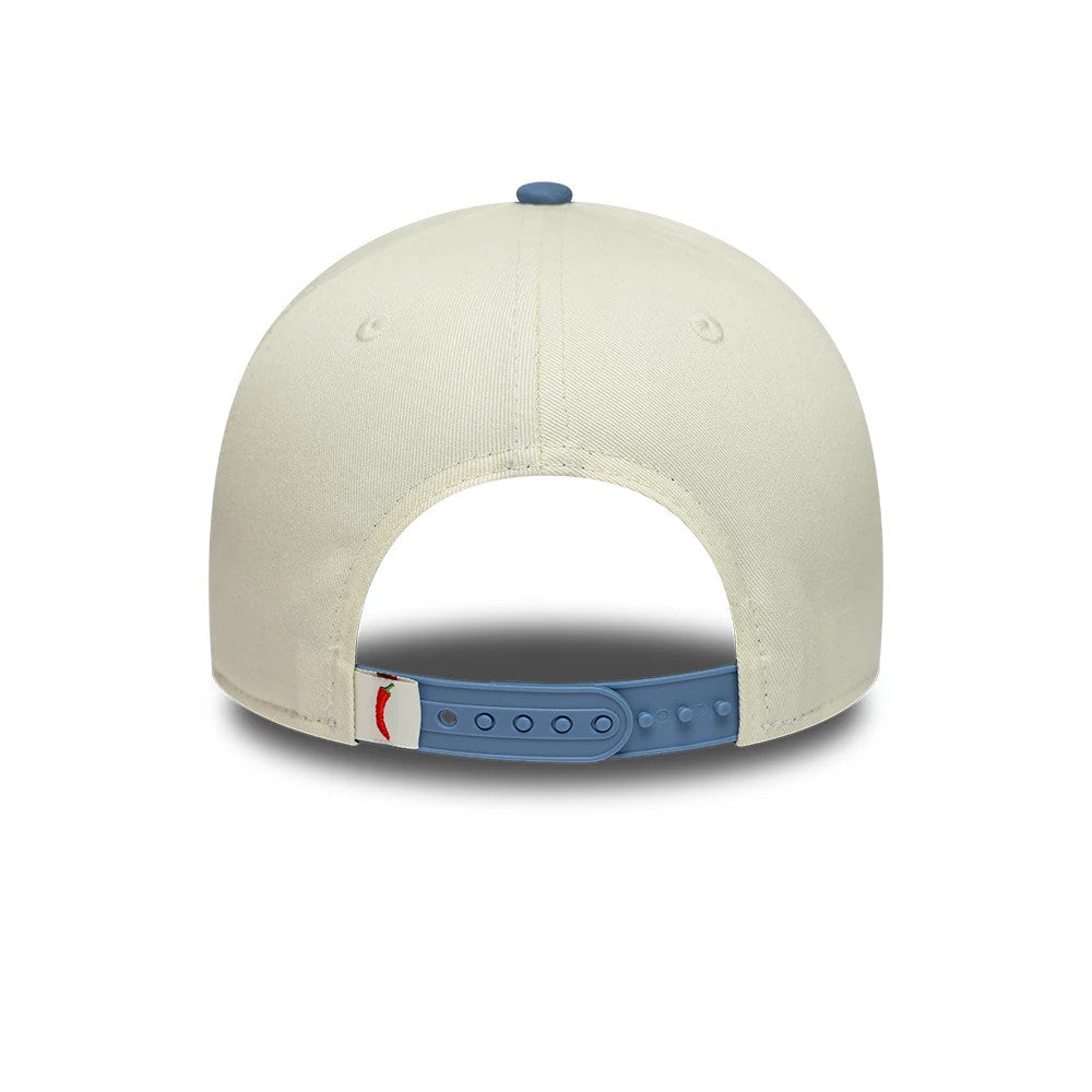 Carlos Sainz Team Fifty5 Contrast Visor Cream New Era 9FORTY A-Frame Adjustable Cap, rear view showing an embroidered red graphic next to the blue adjustable strap and detailed stitching on the cream-coloured panels and top button.