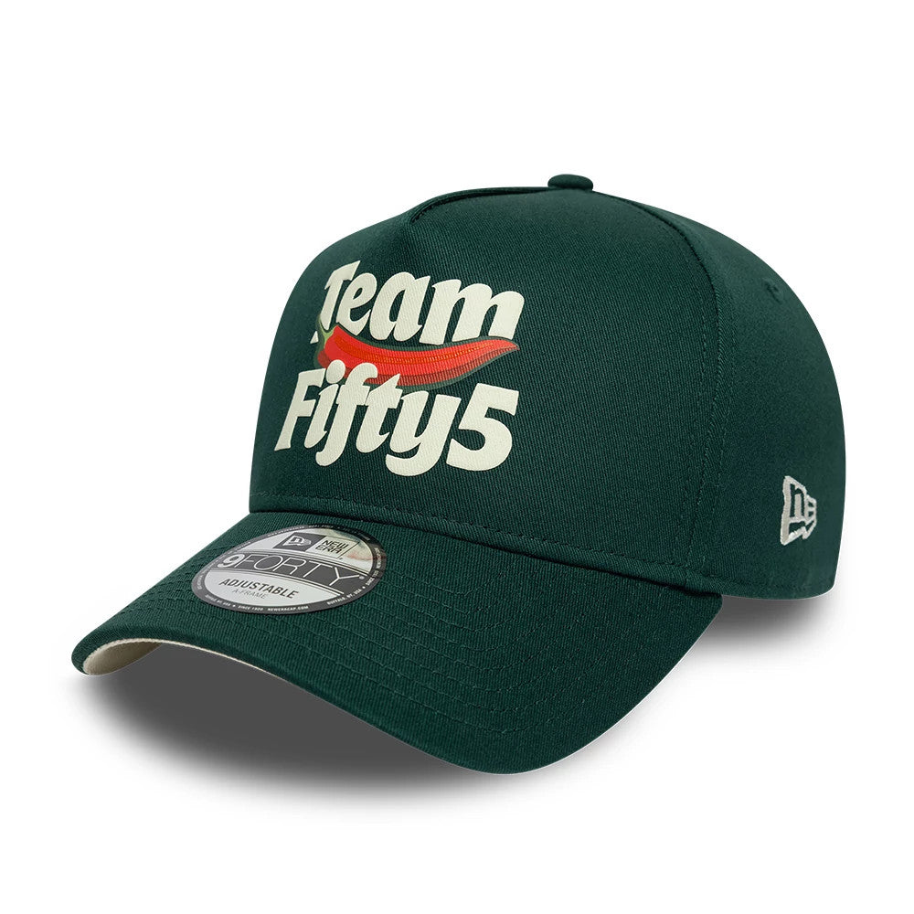 Carlos Sainz Team Fifty5 Puff Print Dark Green New Era 9FORTY A-Frame Adjustable Cap, three-quarter view showing the cream and red Team Fifty5 logo embroidered on the structured dark green front panel.