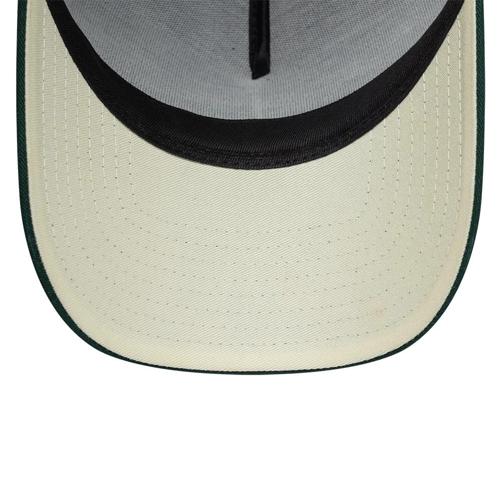 Carlos Sainz Team Fifty5 Puff Print Dark Green New Era 9FORTY A-Frame Adjustable Cap, inside view showing the cream undervisor with black taping and a dark green visor edge, and a contrasting black sweatband lining the interior.