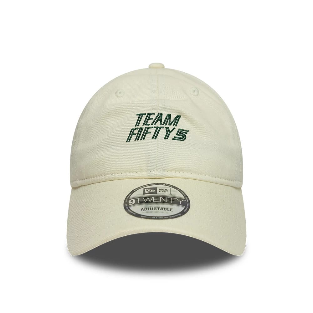 Carlos Sainz Team Fifty5 Cream New Era 9TWENTY Adjustable Cap, front view showing green embroidered Team Fifty5 text on the cream crown, with a curved visor and the 9TWENTY size sticker prominently displayed at the centre.