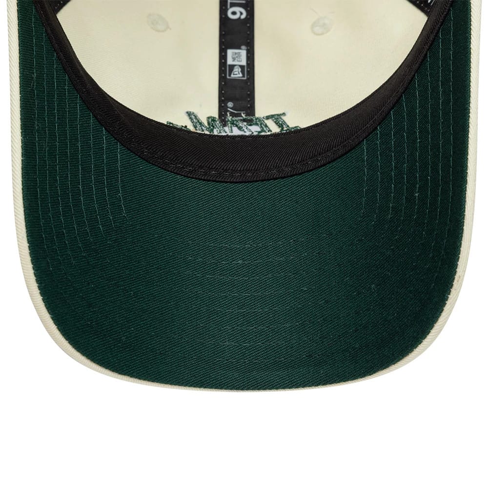 Carlos Sainz Team Fifty5 Cream New Era 9TWENTY Adjustable Cap, inside view showing a dark green undervisor with contrasting cream fabric, black taping with size markings running down the centre, and inner embroidery beneath the crown.