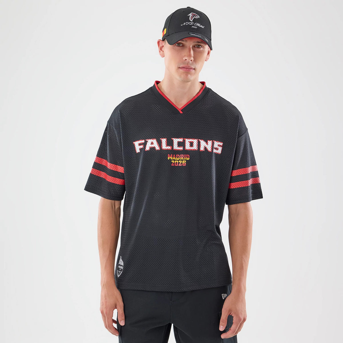 The model is wearing this NFL International Games 2026 Graphic Atlanta Falcons Mesh Jersey in black. 1