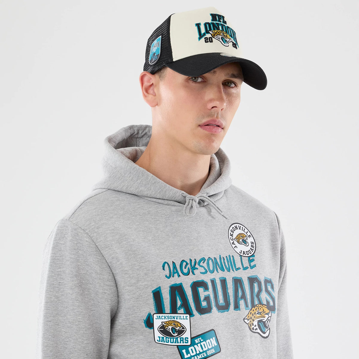 The model is wearing this NFL Patch Jacksonville Jaguars Pullover Hoodie in grey. 4