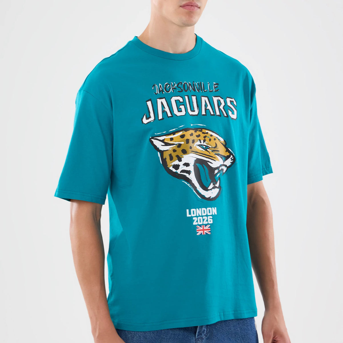 The model is wearing this NFL Graphic Slogan Jacksonville Jaguars Oversized T-Shirt in turquoise. 3