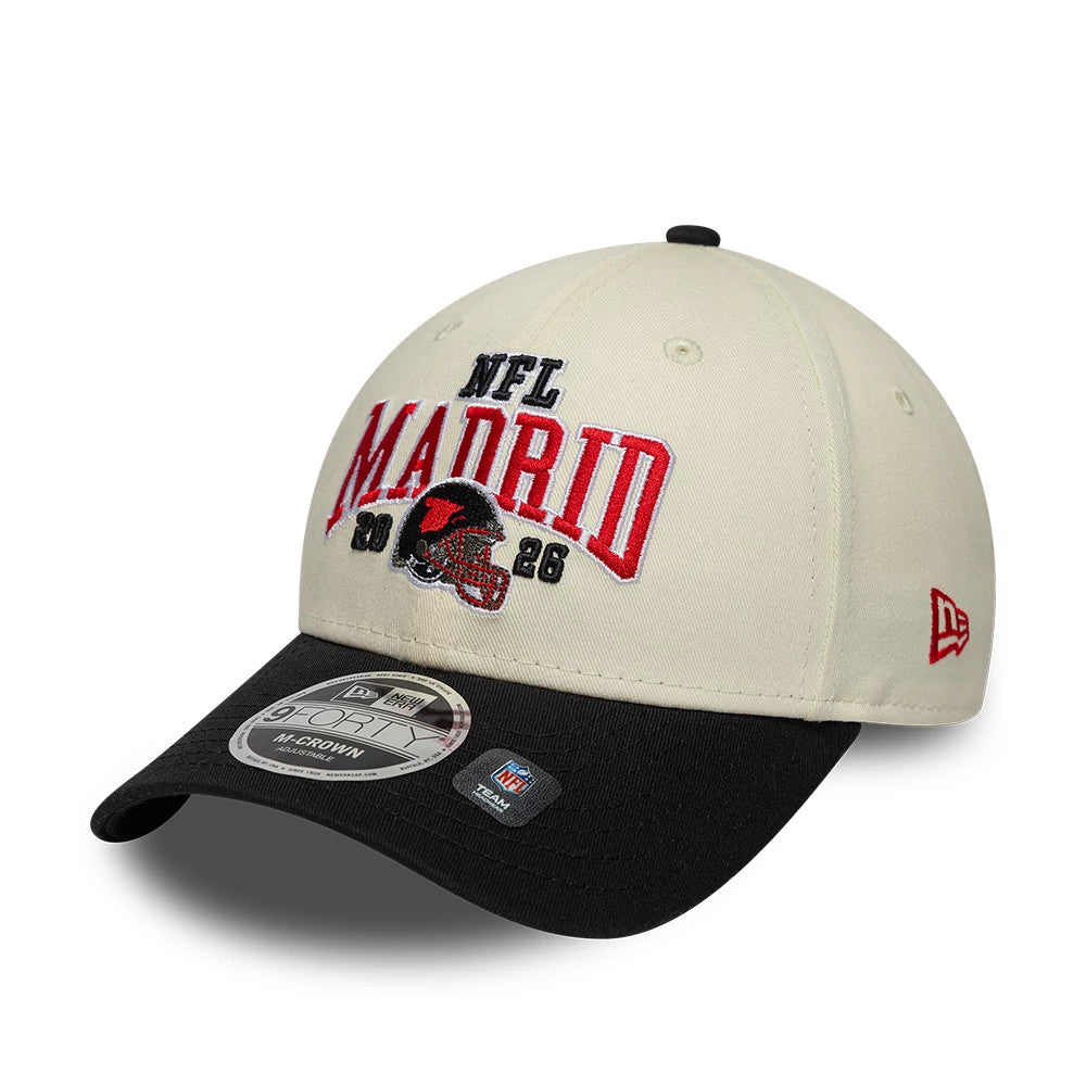 Falcons NFL International Games 2026 Madrid White & Black New Era 9FORTY M-Crown Adjustable Cap, front view showing raised NFL Madrid red and black embroidery on the cream panel, with a contrasting black visor and 9FORTY size sticker.