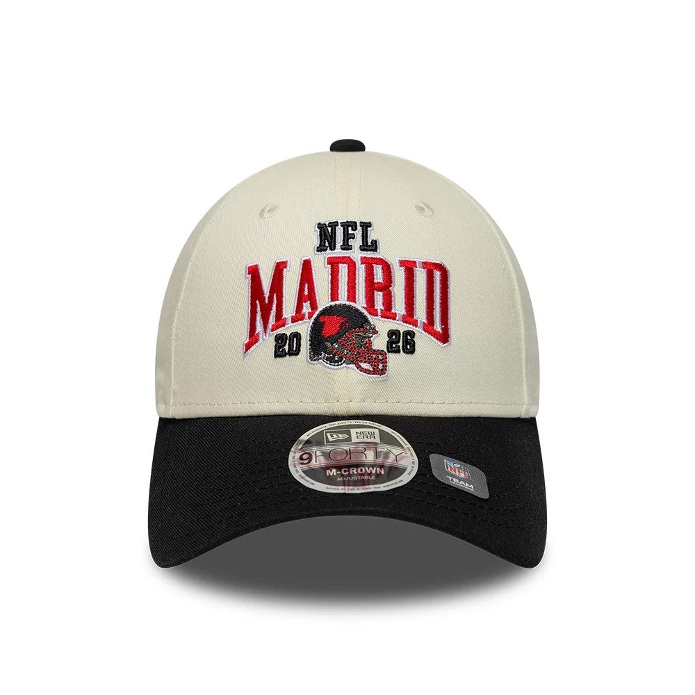 Falcons NFL International Games 2026 Madrid White & Black New Era 9FORTY M-Crown Adjustable Cap, front view showing red and black embroidered NFL Madrid 2026 with a Falcons helmet on the white crown, black visor and 9FORTY size sticker on the visor.