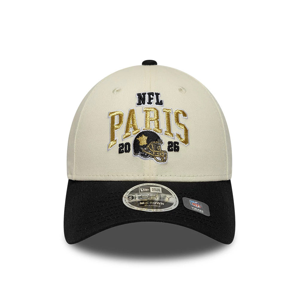 Saints NFL International Games 2026 Paris White & Black New Era 9FORTY M-Crown Adjustable Cap, front view showing the gold and black embroidered NFL Paris 2026 lettering and helmet on the white crown, with a black visor and 9FORTY size sticker.