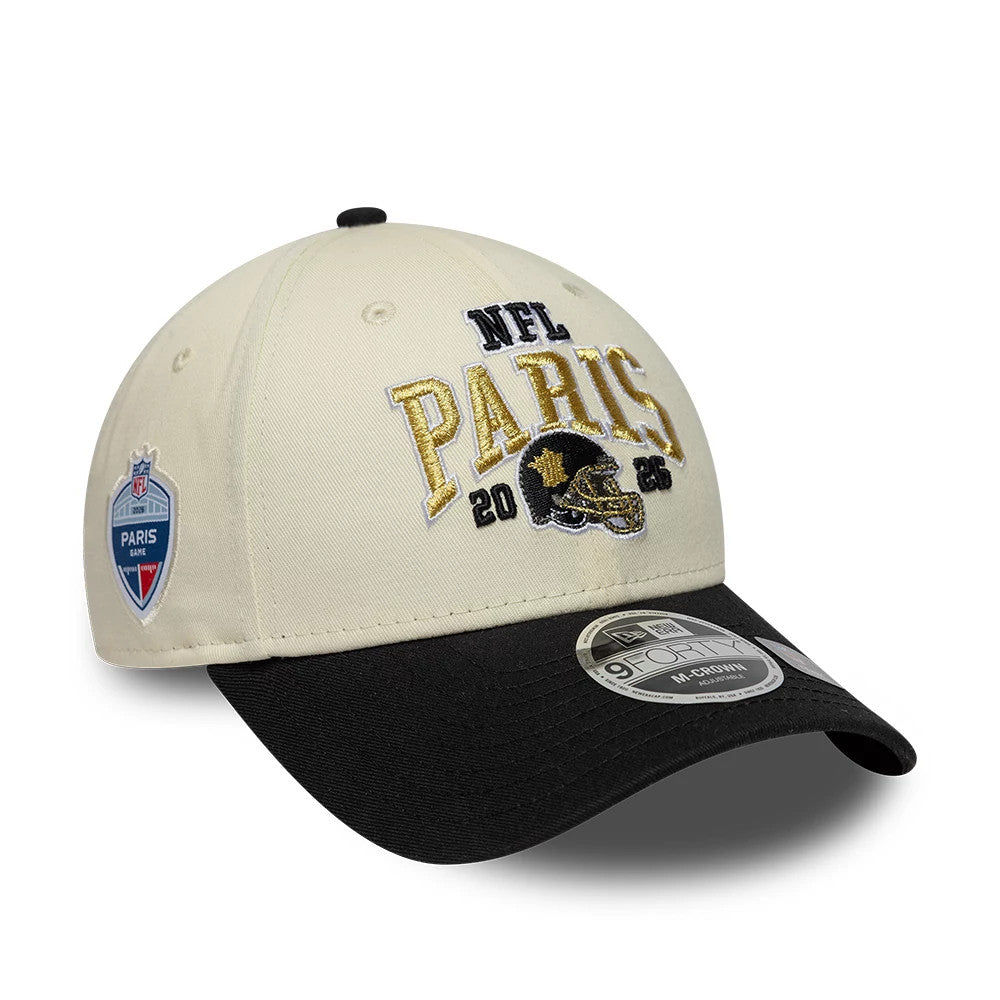 Saints NFL International Games 2026 Paris White & Black New Era 9FORTY M-Crown Adjustable Cap, front view showing the raised embroidered NFL Paris logo in gold and black on the white crown, a black curved visor and a 9FORTY size sticker.