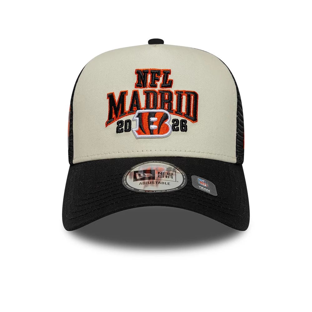 Bengals NFL International Games 2026 Madrid Black New Era 9FORTY A-Frame Trucker Adjustable Cap, front view showing the raised orange and black embroidered NFL Madrid 2026 logo on the cream front panel, with a black curved visor.