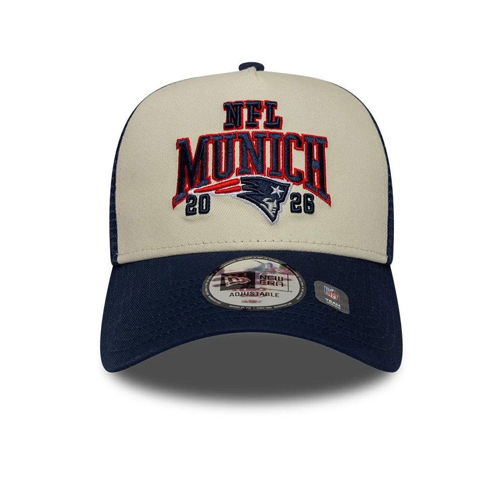 Pictured is this NFL International Games 2026 Munich New England Patriots 9FORTY A-Frame Trucker cap in dark blue. 2