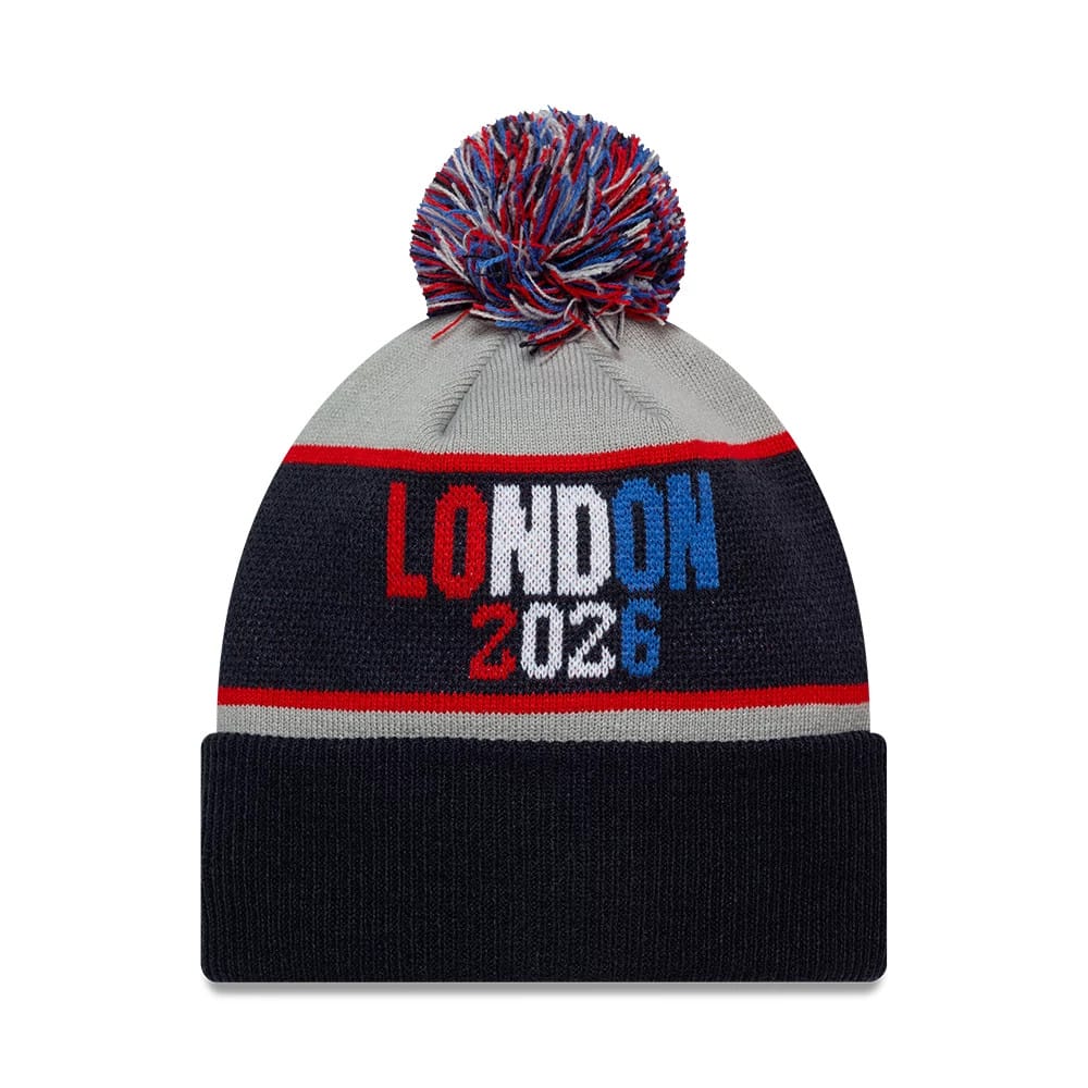 New Era Texans VS Jaguars Dueling Logos NFL International Games 2026 London Navy Cuff Knit Beanie Hat, front view showing a LONDON 2026 text design in red, white, and blue, with a multicoloured pom-pom on top and a navy cuff.