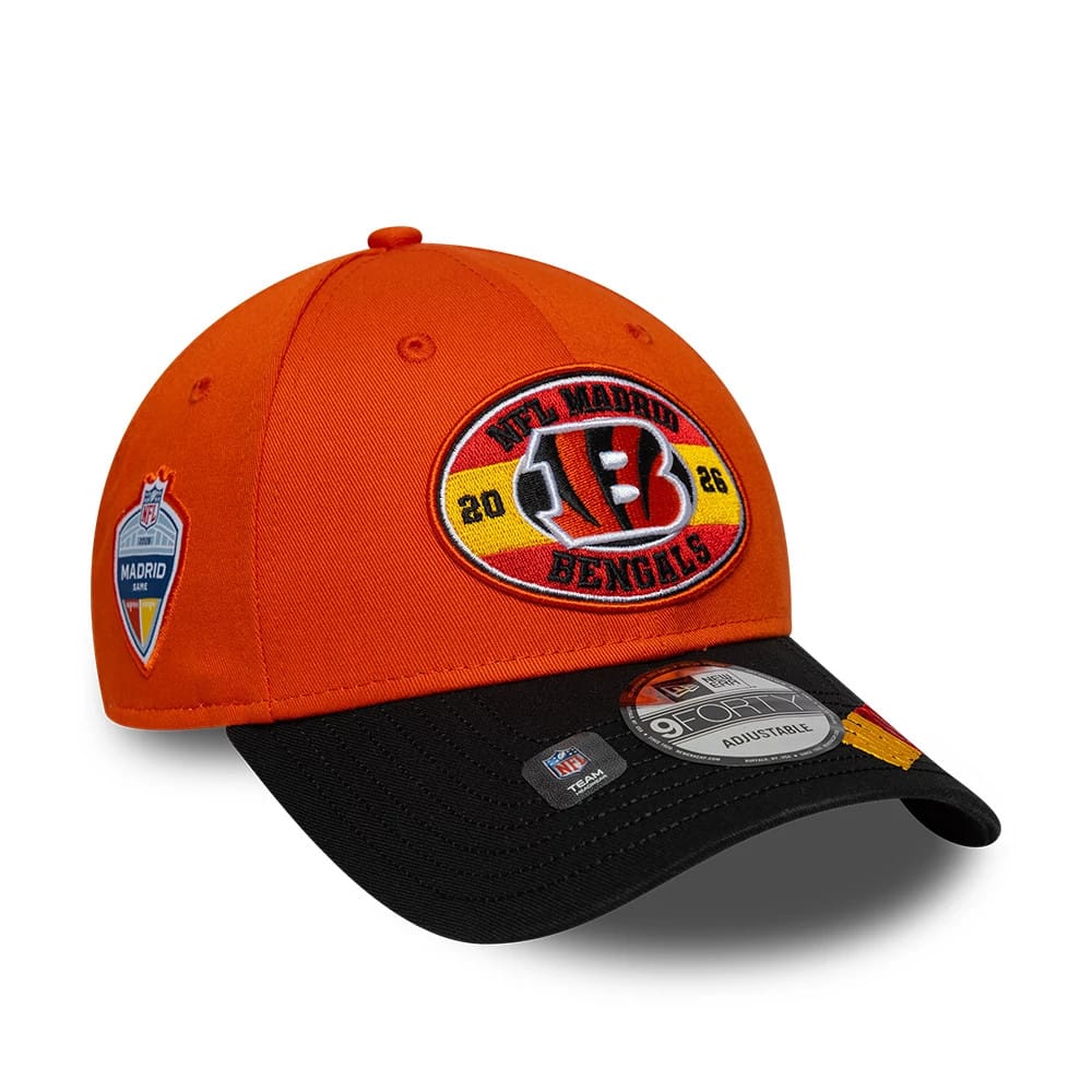 Bengals NFL International Games 2026 Madrid Orange & Black New Era 9FORTY Adjustable Cap, front three-quarter view showing the raised embroidered team logo with Madrid lettering on the orange crown, a black curved visor with a 9FORTY size sticker.
