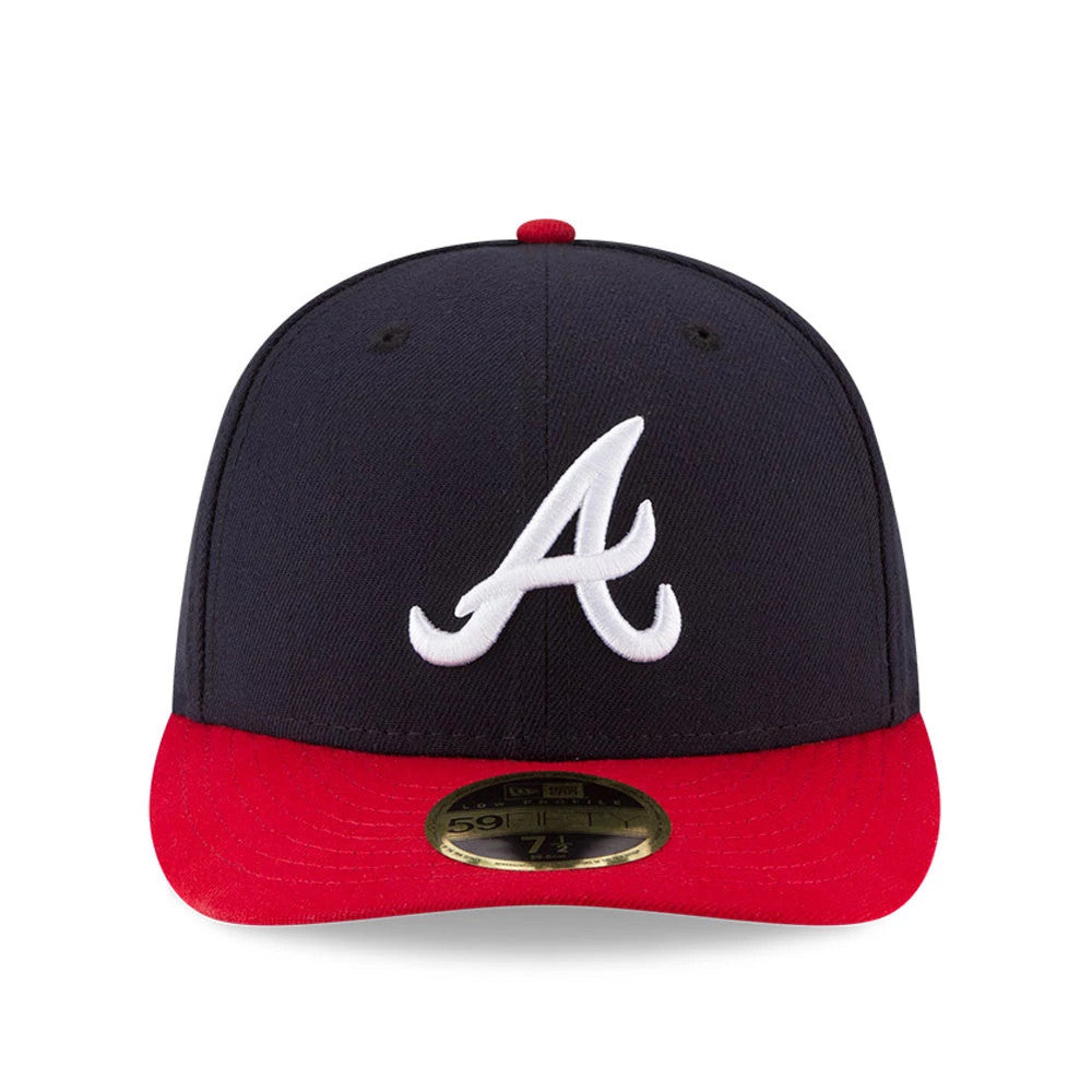 Atlanta Braves Authentic Collection Low Profile New Era 59FIFTY, front view showing the white raised embroidered A logo on the structured dark crown, red curved visor, and the gold 59FIFTY size sticker centrally placed on the visor.