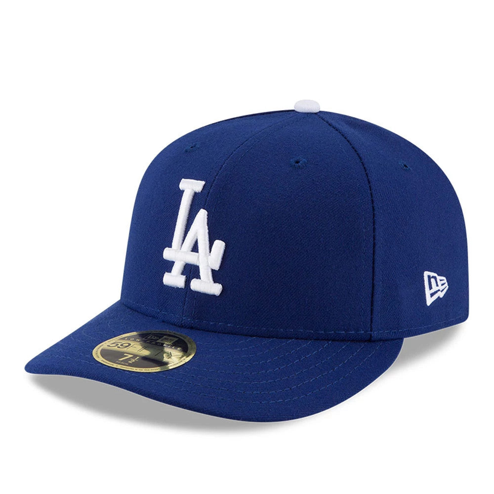 LA Dodgers Authentic Collection New Era 59FIFTY Low Profile Cap, three-quarter view showing the white raised LA logo embroidered on the front panel, blue curved visor with a gold 59FIFTY size sticker, and New Era flag logo on the left side.