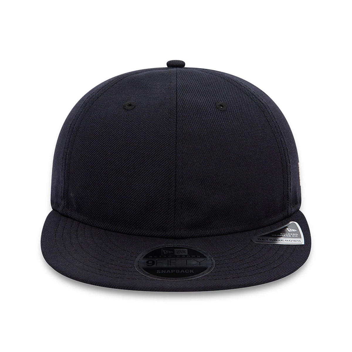 Blank New Era Navy Retro Crown 9FIFTY Snapback Cap, front view showing the plain navy front panel with eyelets, a flat navy visor adorned with a 9FIFTY size sticker, and a classic top button matching the crown colour.