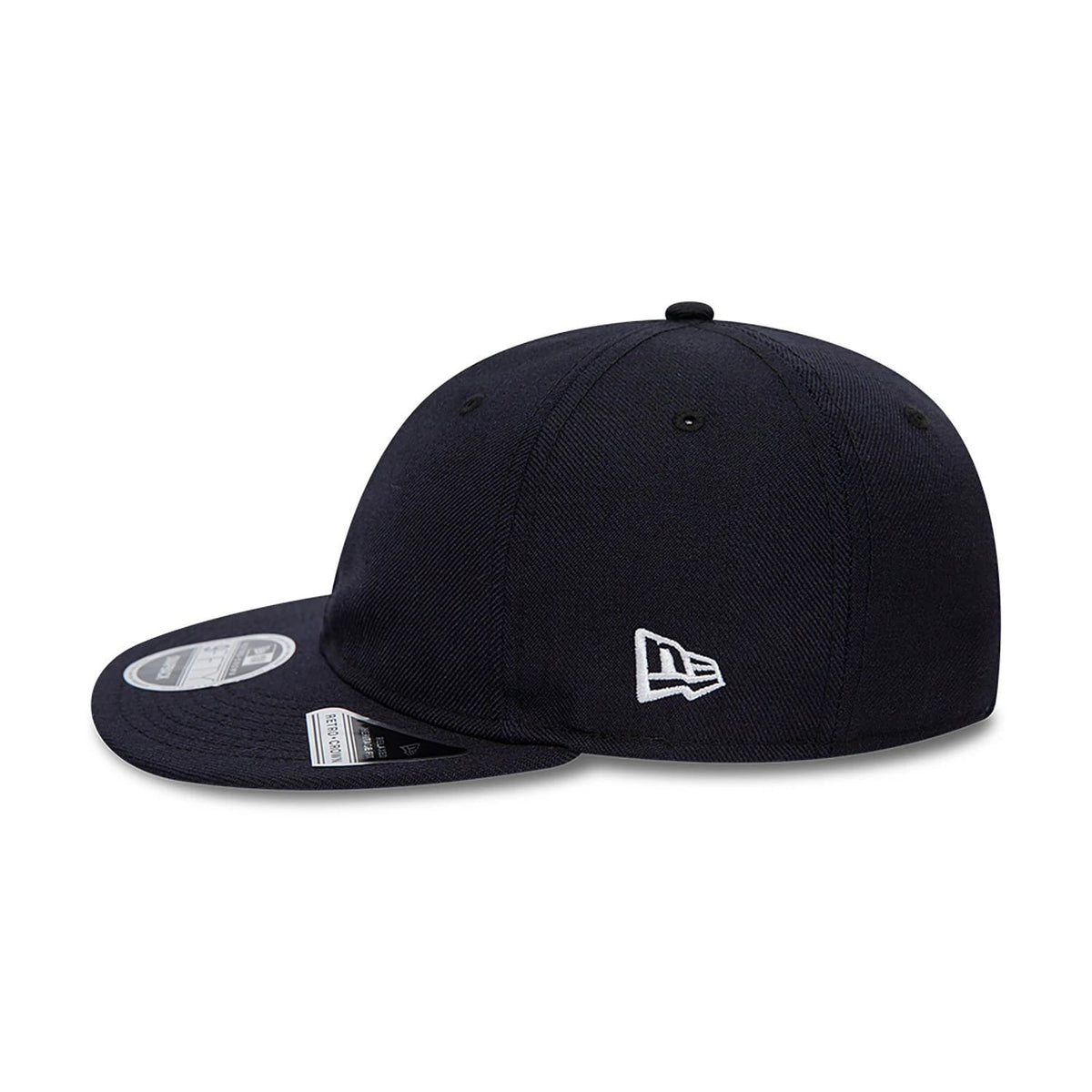 Blank New Era Navy Retro Crown 9FIFTY Snapback Cap, side view showing the white embroidered New Era flag logo on the left side of the structured navy crown, with a flat visor and a 9FIFTY size sticker on the top.