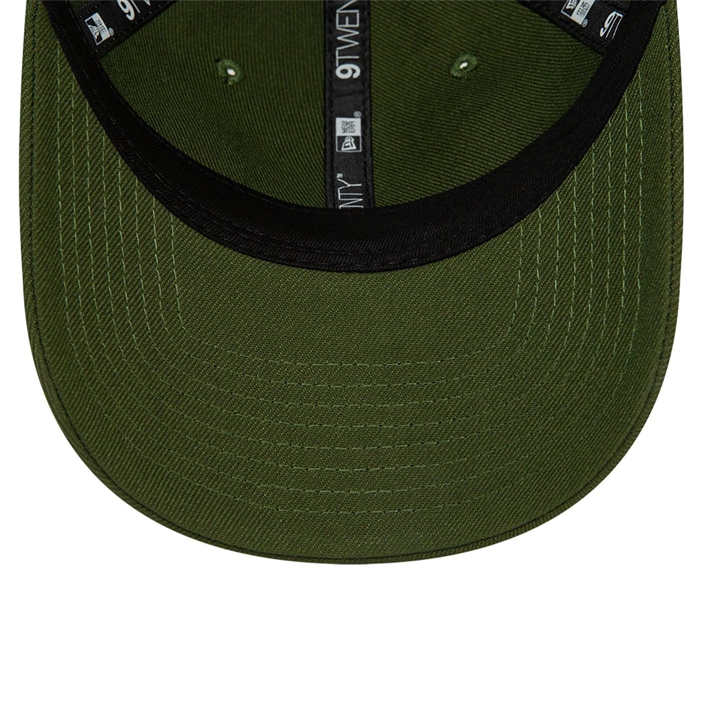 New Era Blank Dark Green 9TWENTY Adjustable Cap, inside view showing the green undervisor with clearly stitched panel seams, black sweatband around the edge, and 9TWENTY branding in white on black taping along the centre.