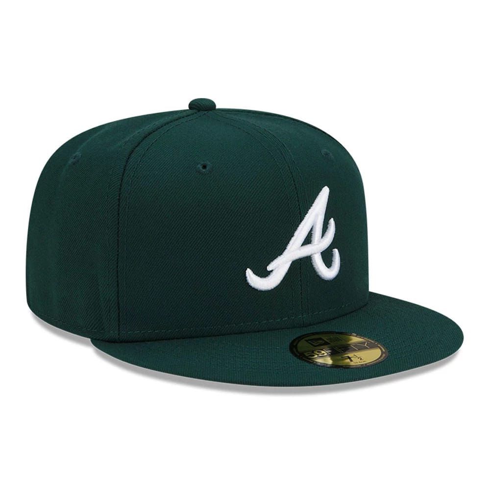 Atlanta Braves MLB Dark Green New Era 59FIFTY Fitted Cap, three-quarter view showing the raised white embroidered A logo on the structured dark green crown, complemented by a matching flat visor and a gold 59FIFTY size sticker on the visor.