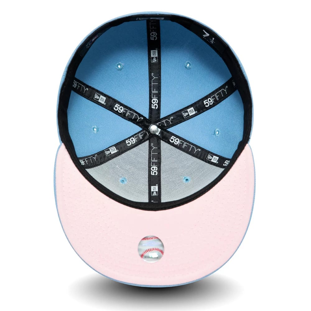 LA Dodgers Palm Taco Blue New Era 59FIFTY Cap, inside view showing black 59FIFTY branded taping across a light blue interior crown, a pastel pink undervisor and a detailed baseball graphic positioned centrally on the undervisor.