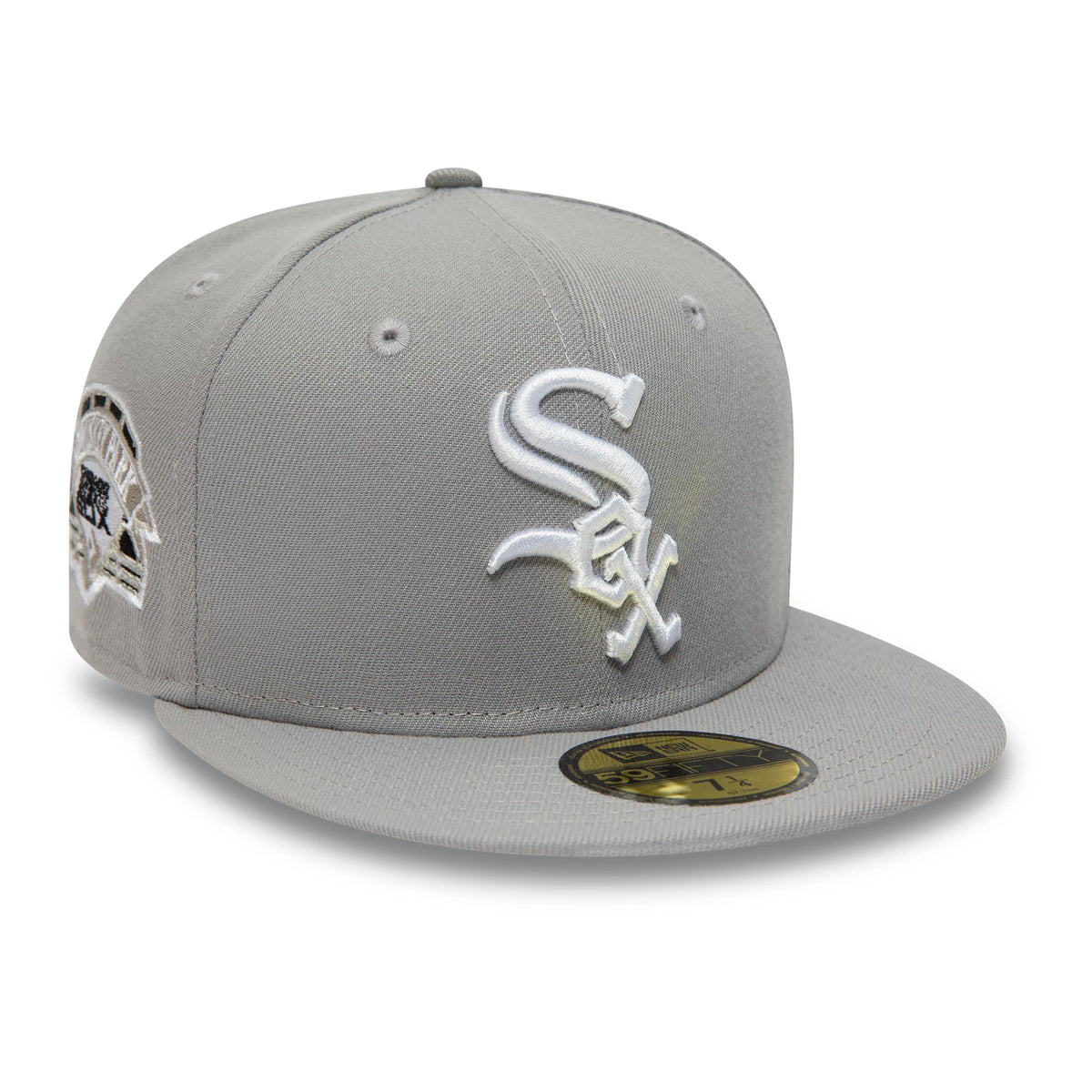 Chicago White Sox Essential Pack Grey New Era 59FIFTY Fitted Cap, three-quarter view showing a white raised embroidered Sox logo on the front panel, a commemorative patch on the right side, and a gold 59FIFTY size sticker on the flat grey visor.