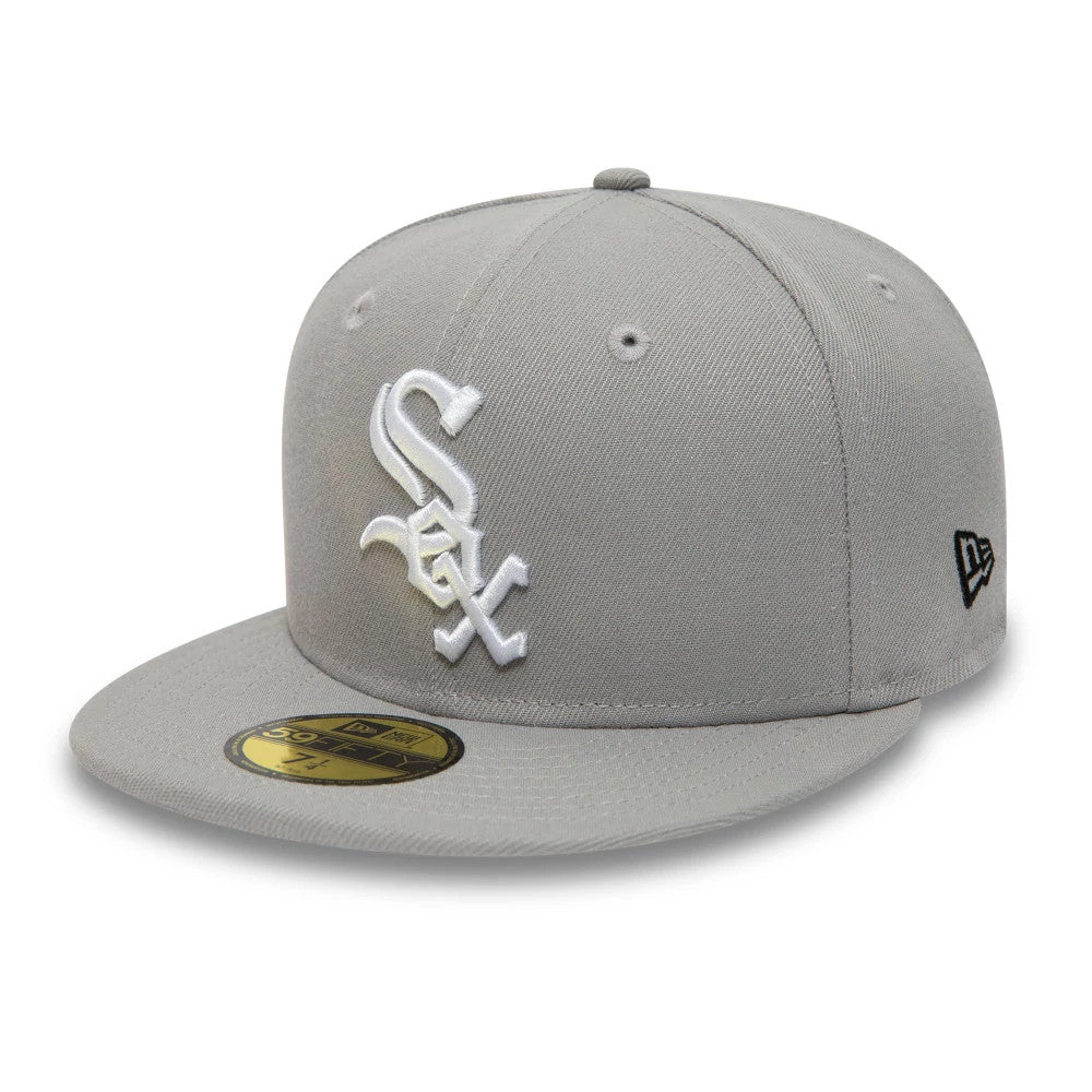 Chicago White Sox Essential Pack Grey New Era 59FIFTY Fitted Cap, three-quarter view showing the raised white Sox logo on the front panel, a flat grey visor with a gold 59FIFTY size sticker, and the New Era flag logo on the left side.