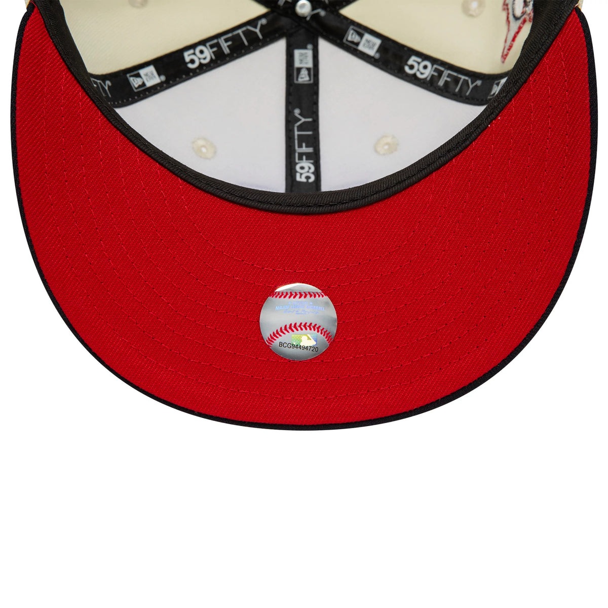 Minnesota Twins MLB White New Era 59FIFTY Fitted Cap, inside view showing the black 59FIFTY labelled taping across the cream panels, a red undervisor, and a baseball-themed sticker centrally placed on the red undervisor.