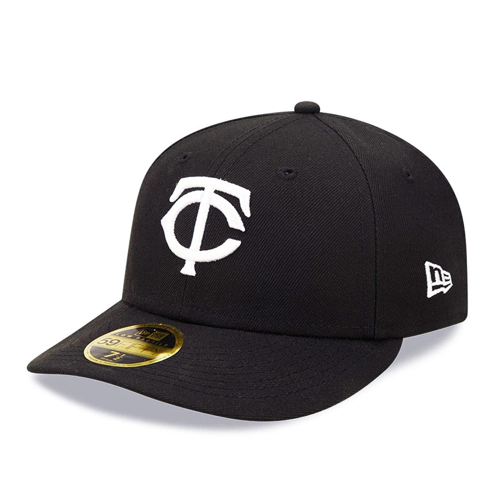 Minnesota Twins MLB Black Low Profile New Era 59FIFTY Fitted Cap, three-quarter view showing the white raised embroidered TC logo on the front panels, a curved black visor with a gold 59FIFTY size sticker, and the New Era flag logo on the left side.