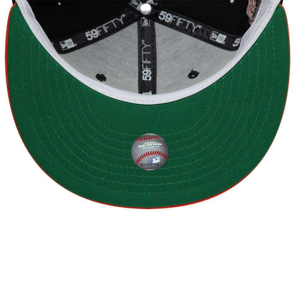 San Francisco Giants MLB Cooperstown Black New Era 59FIFTY Fitted Cap, inside view showing grey taping with repeated 59FIFTY branding, a green undervisor with a central MLB baseball sticker, and a contrasting orange visor edge.