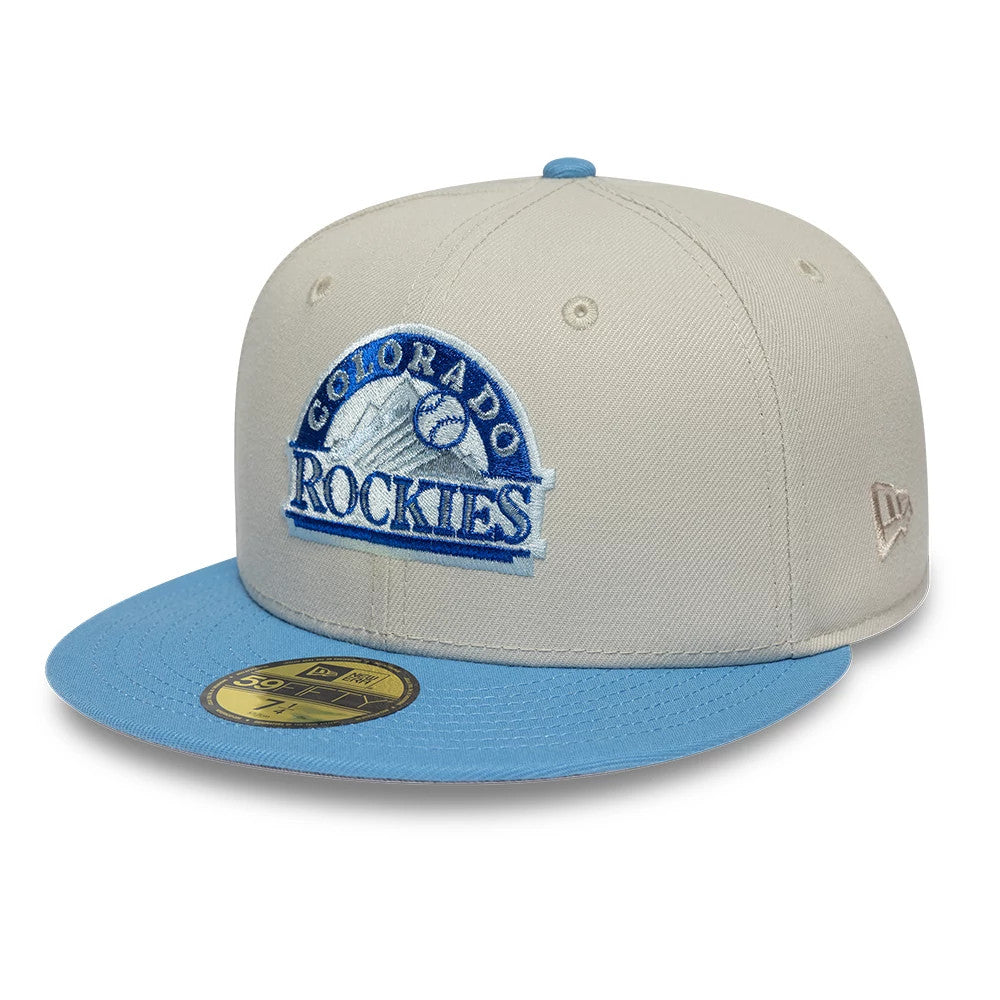 Colorado Rockies MLB Cooperstown Cream New Era 59FIFTY Fitted Cap, front view showing a raised blue and white embroidered Rockies logo on the cream front panel, with a light blue flat visor and a gold 59FIFTY size sticker.