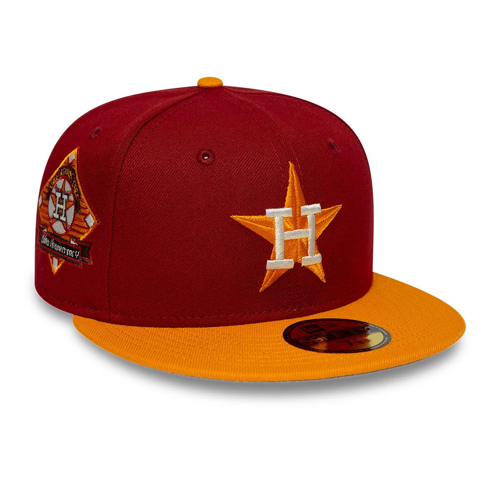 Houston Astros MLB Cooperstown Dark Red New Era 59FIFTY Fitted Cap, three-quarter view showing the raised embroidered white and orange logo on the front panel, contrasting yellow visor with gold 59FIFTY size sticker.
