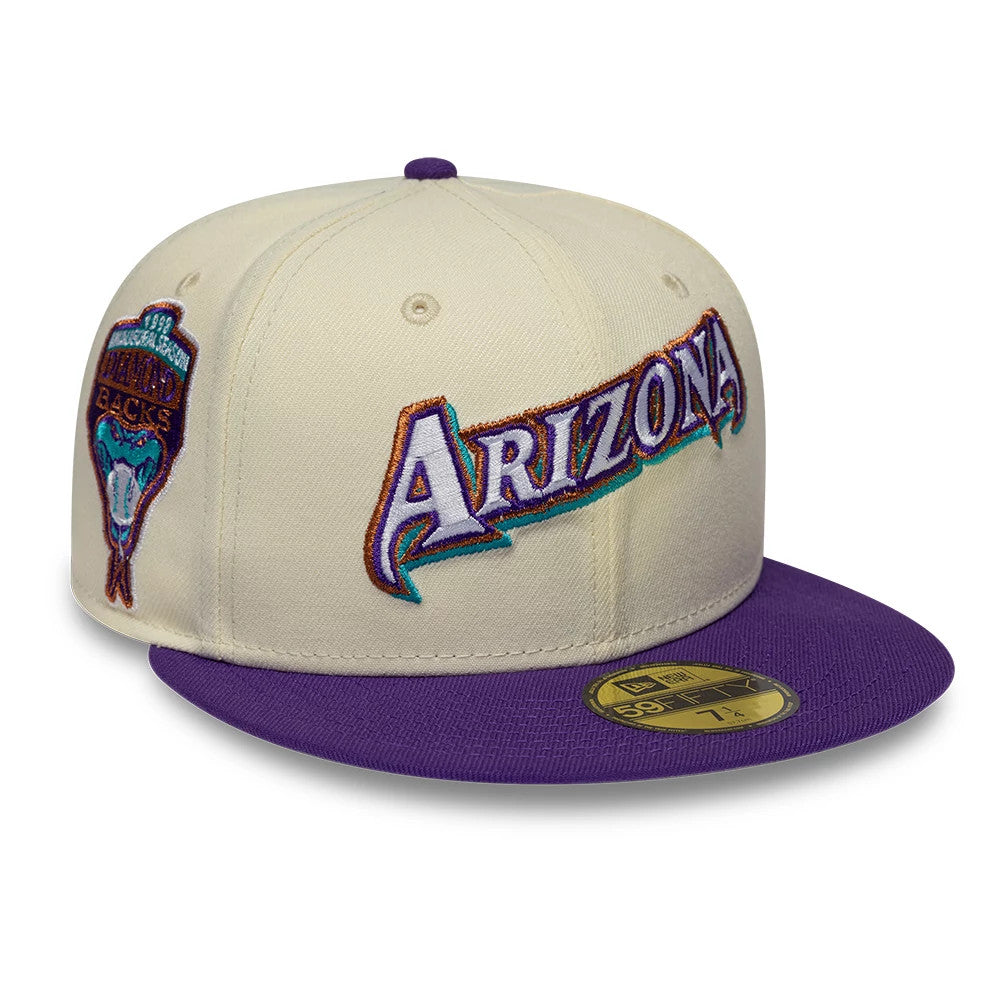 Arizona Diamondbacks MLB Cooperstown White New Era 59FIFTY Fitted Cap, front view showing the raised multicoloured embroidered Arizona lettering on the front panel, a purple visor with a gold 59FIFTY size sticker, and a side team logo patch.