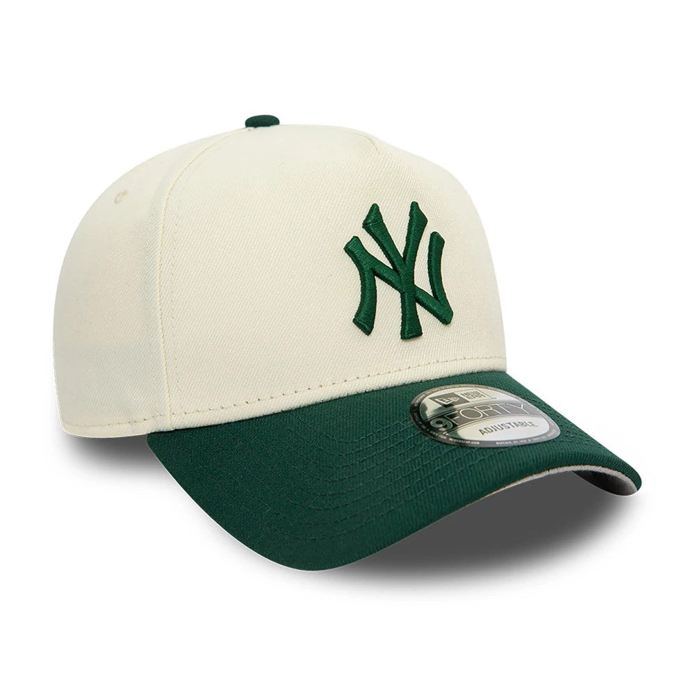 New York Yankees Chrome White And Dark Green New Era 9FORTY A-Frame Adjustable Cap, three-quarter view showing the dark green raised embroidered NY logo on the white front panel, dark green curved visor, and 9FORTY size sticker on the visor.