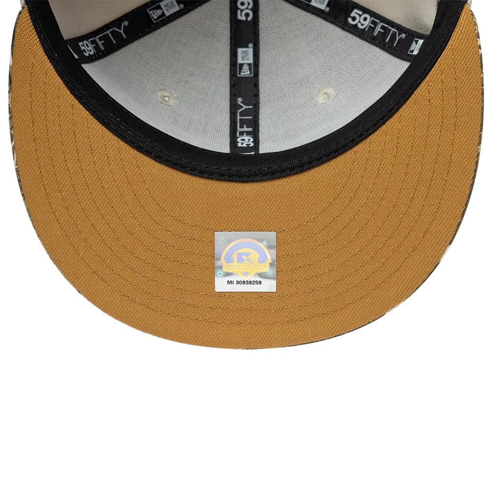 Gwinnett Stripers MiLB Hometown Sidepatch Beige New Era 59FIFTY Fitted Cap, inside view showing black taping with white 59FIFTY logos, a black sweatband, and a holographic sticker on the curved beige undervisor.