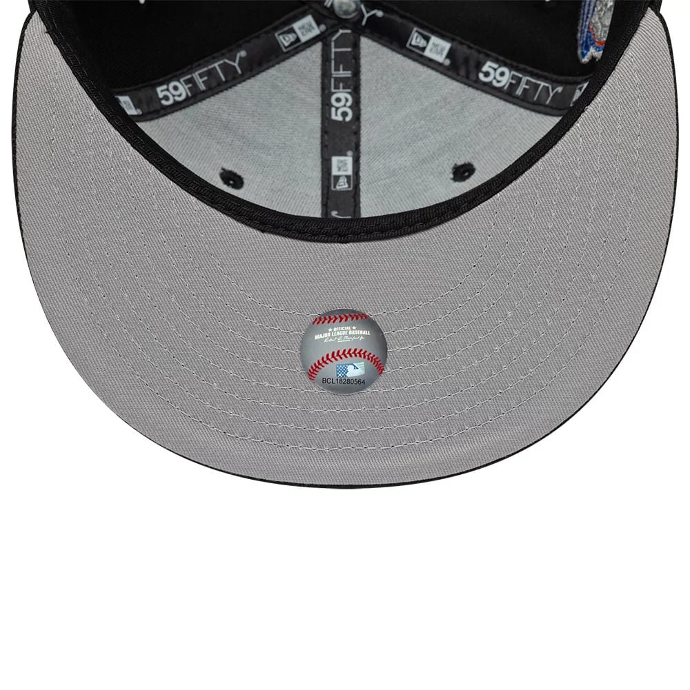 New York Yankees MLB Cooperstown Black New Era 59FIFTY Fitted Cap, inside view showing the black taping with white 59FIFTY branding, a grey undervisor with a round baseball-themed sticker, and a black sweatband lining the structured crown.