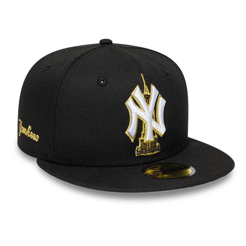 New York Yankees MLB Empire State Black New Era 59FIFTY Fitted Cap, three-quarter view showing the raised white and gold NY logo with the Empire State Building on the front panel, a gold Yankees script on the side.