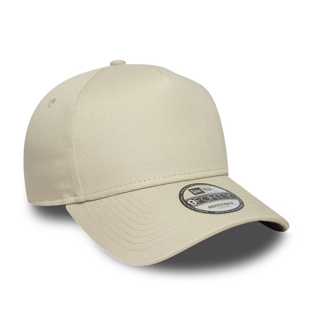 New Era Beige 9FORTY A-Frame Adjustable Cap, three-quarter view showing a curved beige visor with stitching, a structured crown with small eyelets and a 9FORTY size sticker placed on the visor's top surface.