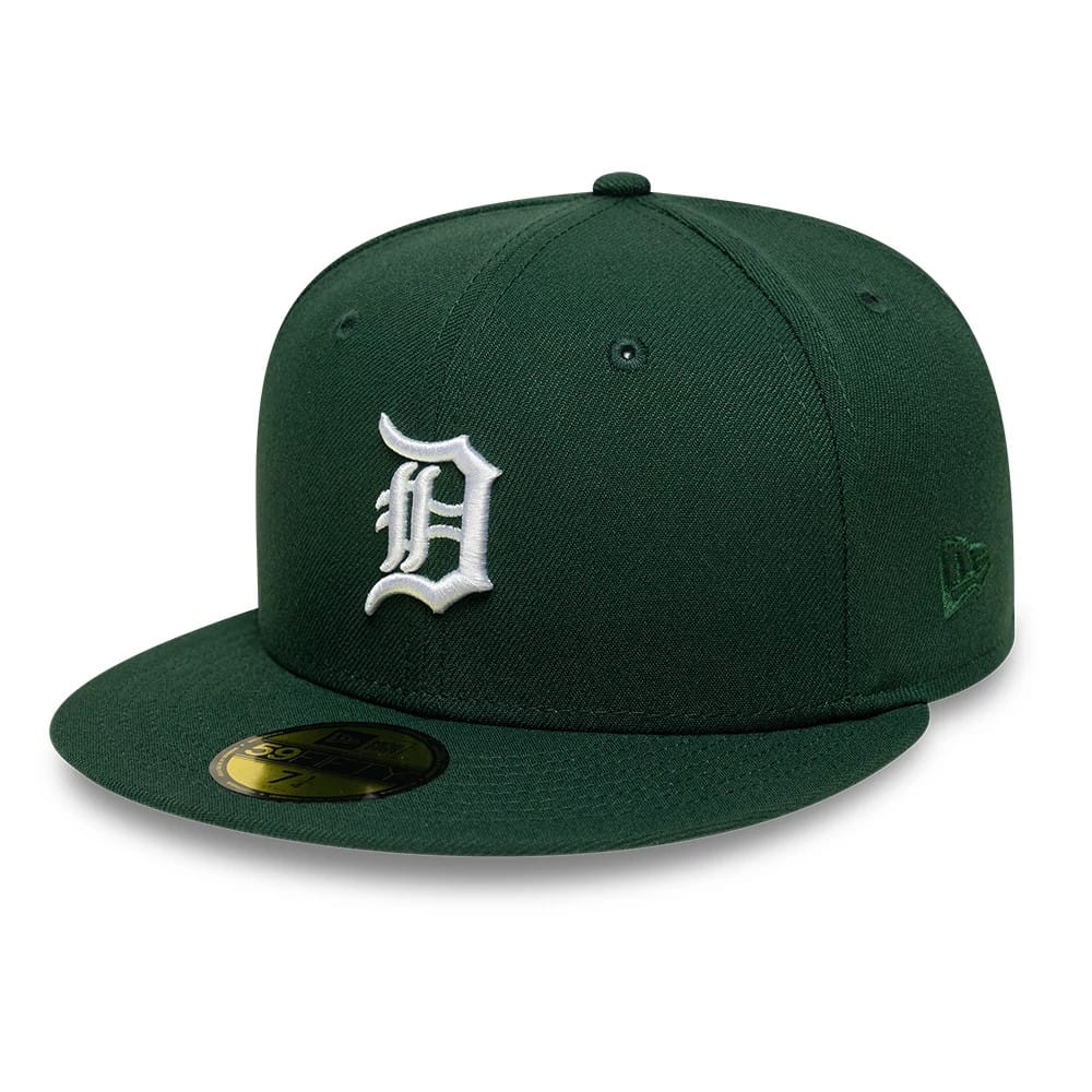Detroit Tigers MLB Dark Green New Era 59FIFTY Fitted Cap, three-quarter view showing the white raised embroidered Detroit D logo on the front panels, a dark green visor with a gold 59FIFTY size sticker, and New Era flag logo on the left side.