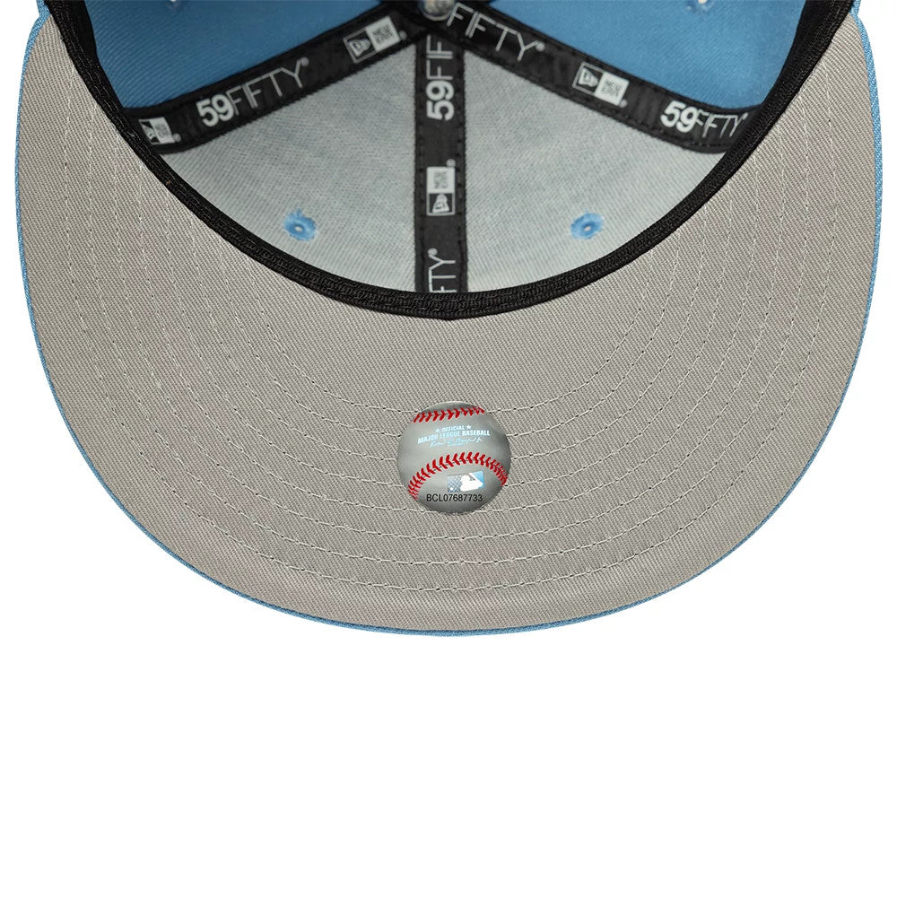 LA Dodgers MLB Blue New Era 59FIFTY Fitted Cap, inside view showing grey undervisor with a baseball-shaped sticker, black 59FIFTY taping with logos, and a blue sweatband with matching blue stitching and eyelets.